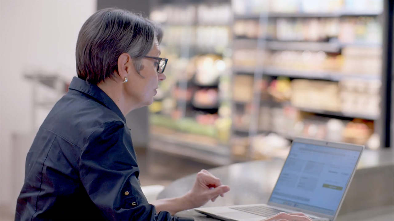 Customer experience team member at a computer, ordering a replacement door